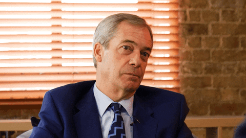 A weirdly grinning Farage